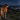 Golden retriever wearing an LED pet safety light during a nighttime outdoor walk, looking across a moonlit valley.